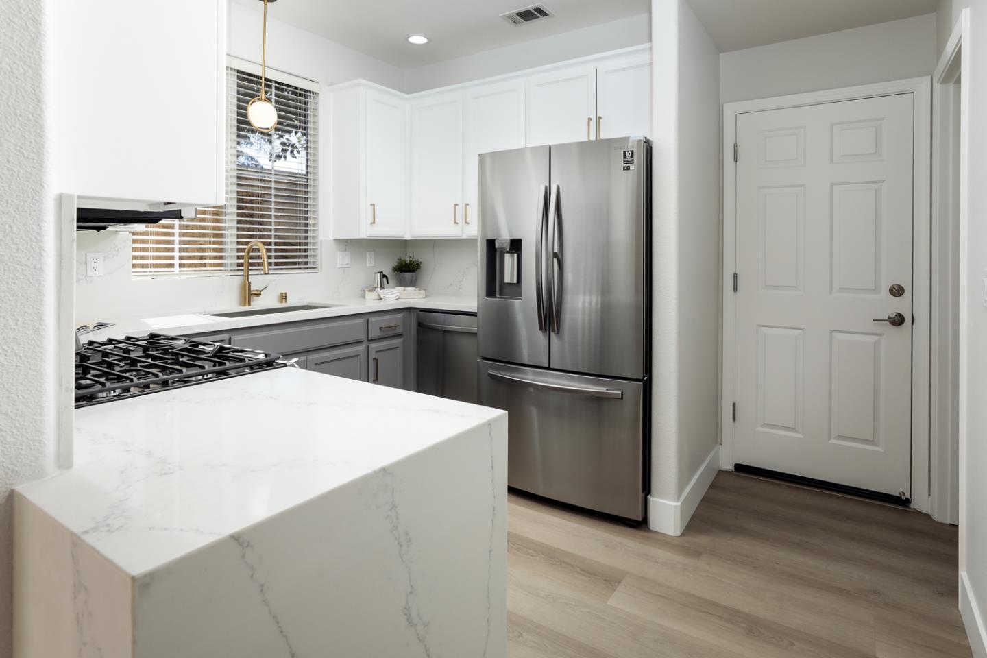 425 Nicholas Drive Mountain View, CA 94043 - Photo 13 of 36 a kitchen with stainless steel appliances a refrigerator and a stove