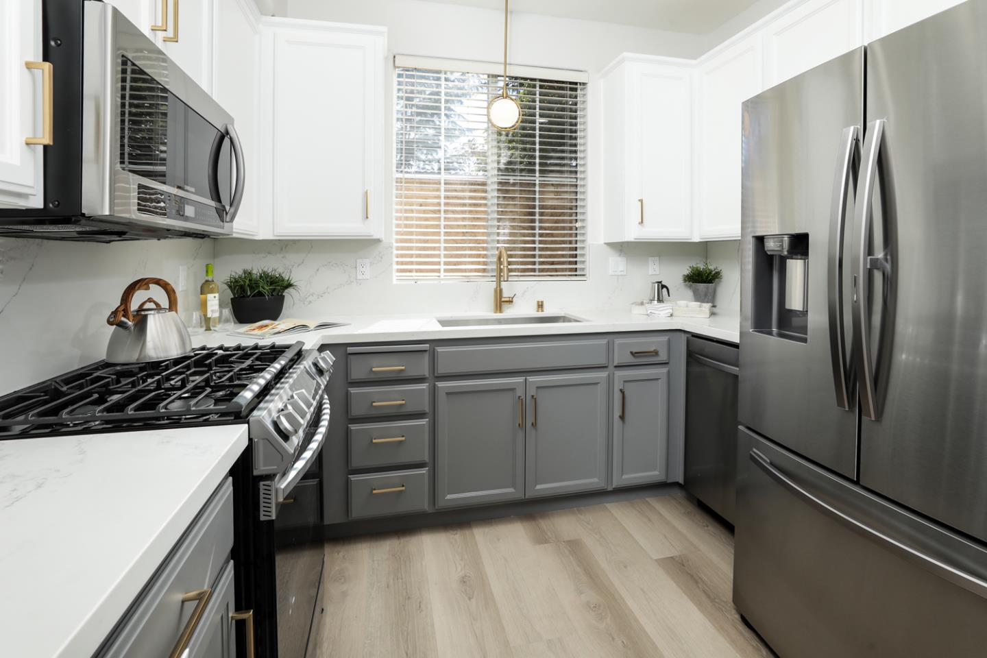 425 Nicholas Drive Mountain View, CA 94043 - Photo 14 of 36 a kitchen with stainless steel appliances a sink stove and refrigerator