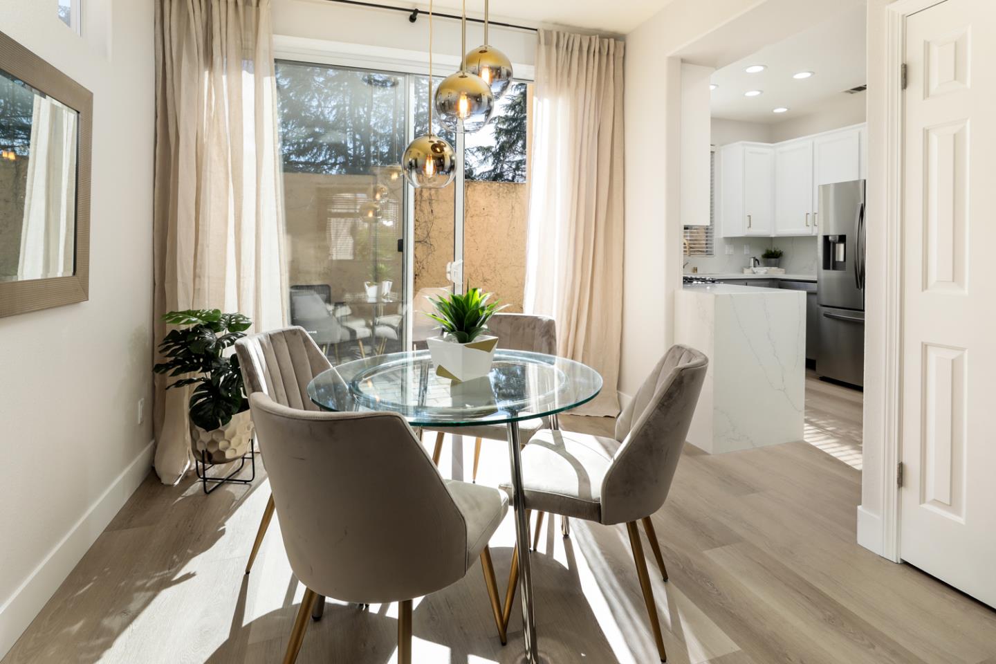 425 Nicholas Drive Mountain View, CA 94043 - Photo 6 of 36 a dining room with furniture a chandelier and wooden floor