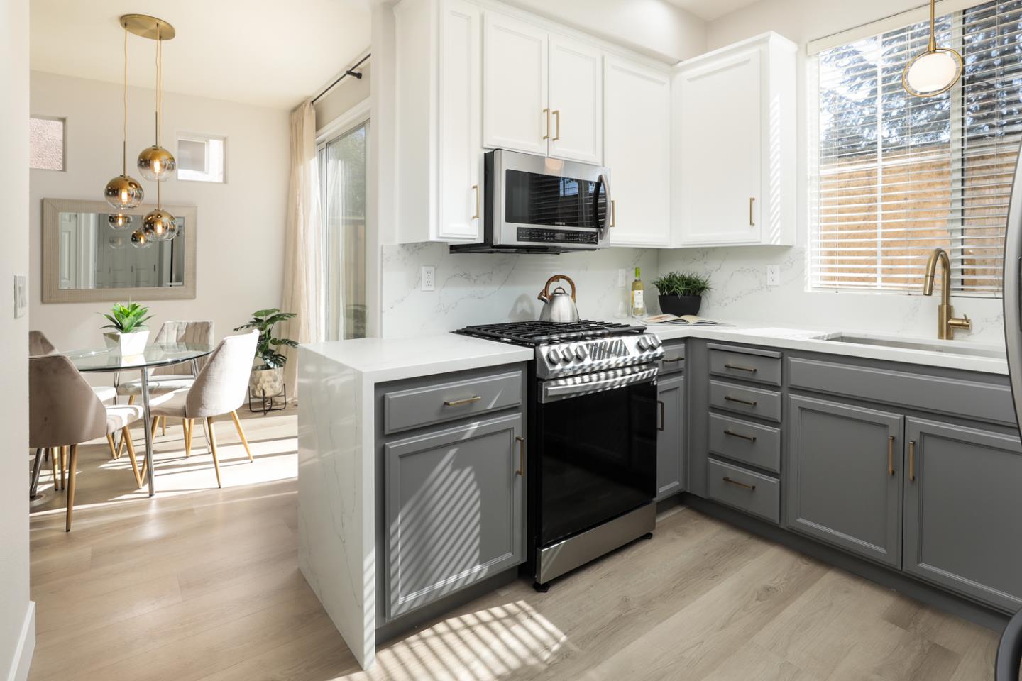 425 Nicholas Drive Mountain View, CA 94043 - Photo 9 of 36 a kitchen with a sink stove and microwave