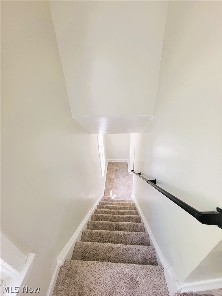 1557 Maplegrove Road South Euclid, OH 44121 - Photo 15 of 23 Stairs with carpet floors