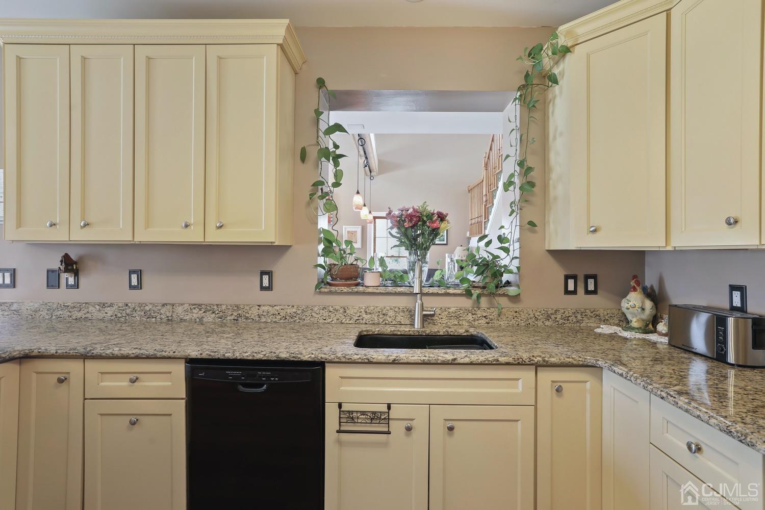 39 Loveman Road Cream Ridge, NJ 08514 - Photo 24 of 73 a kitchen with stainless steel appliances granite countertop white cabinets sink and a granite counter top