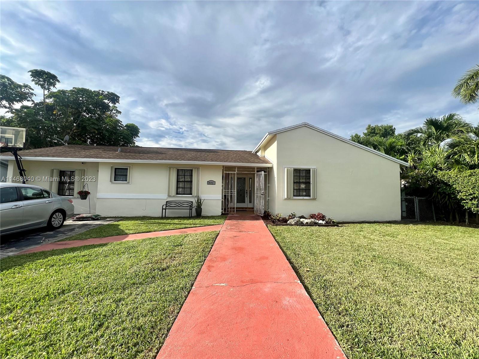 10351 Southwest 164th Street Miami, FL 33157 - Photo 1 of 1 a front view of house with yard and green space