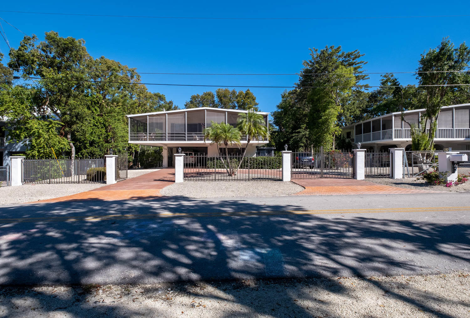 205 Sunset Boulevard Key Largo, FL 33037 - Photo 2 of 42 a swimming pool with outdoor seating and yard
