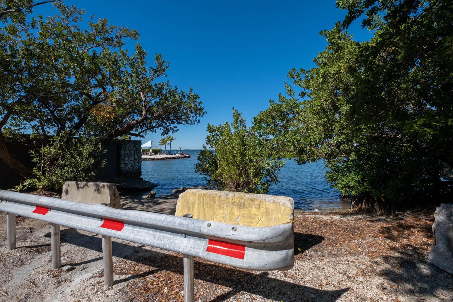 205 Sunset Boulevard Key Largo, FL 33037 - Photo 23 of 42 a backyard of a house with table and chairs