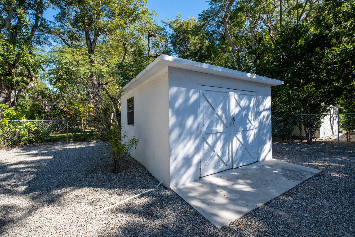 205 Sunset Boulevard Key Largo, FL 33037 - Photo 27 of 42 a backyard of a house with lots of green space