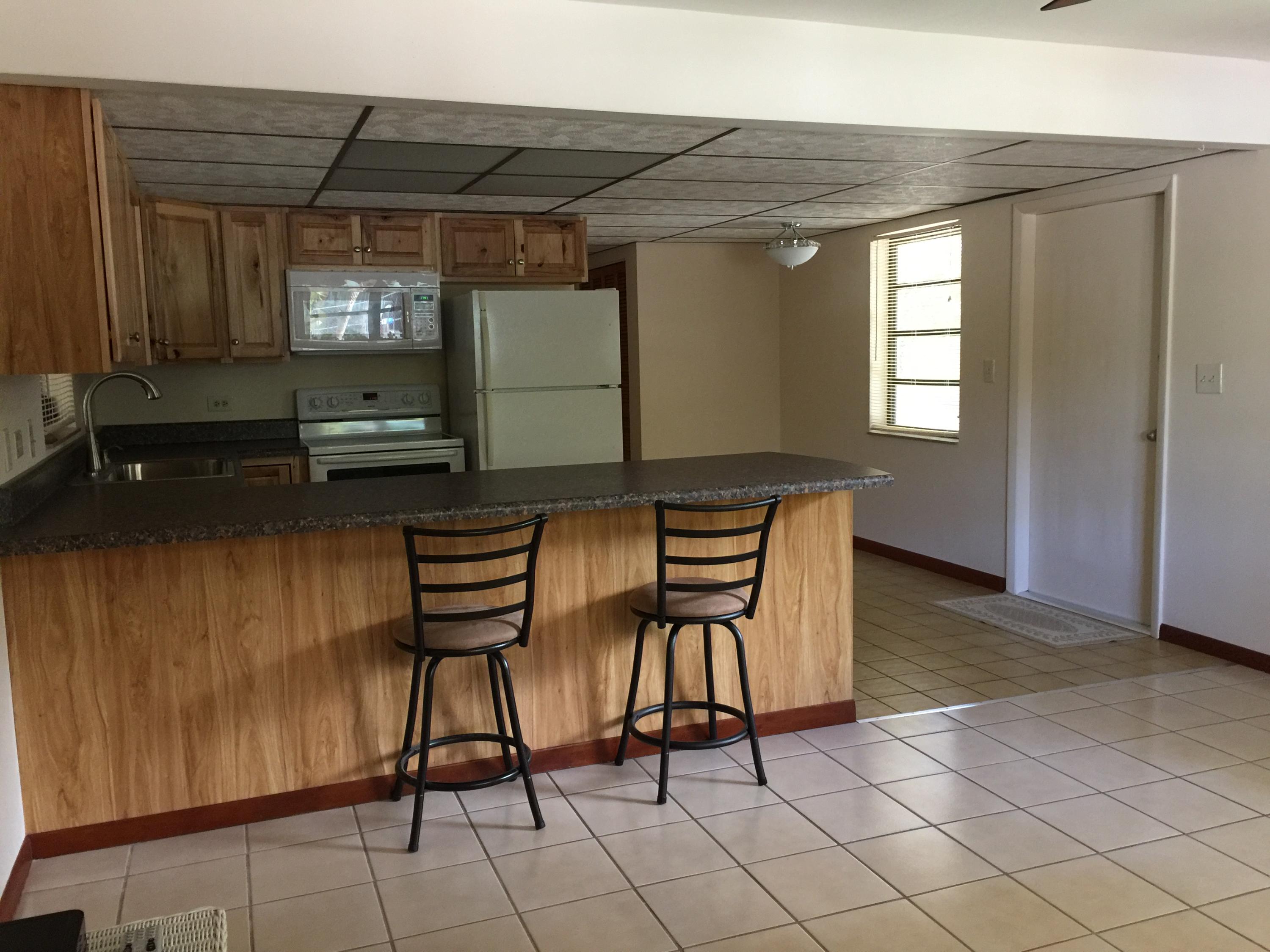 205 Sunset Boulevard Key Largo, FL 33037 - Photo 40 of 42 a patio with table and chairs