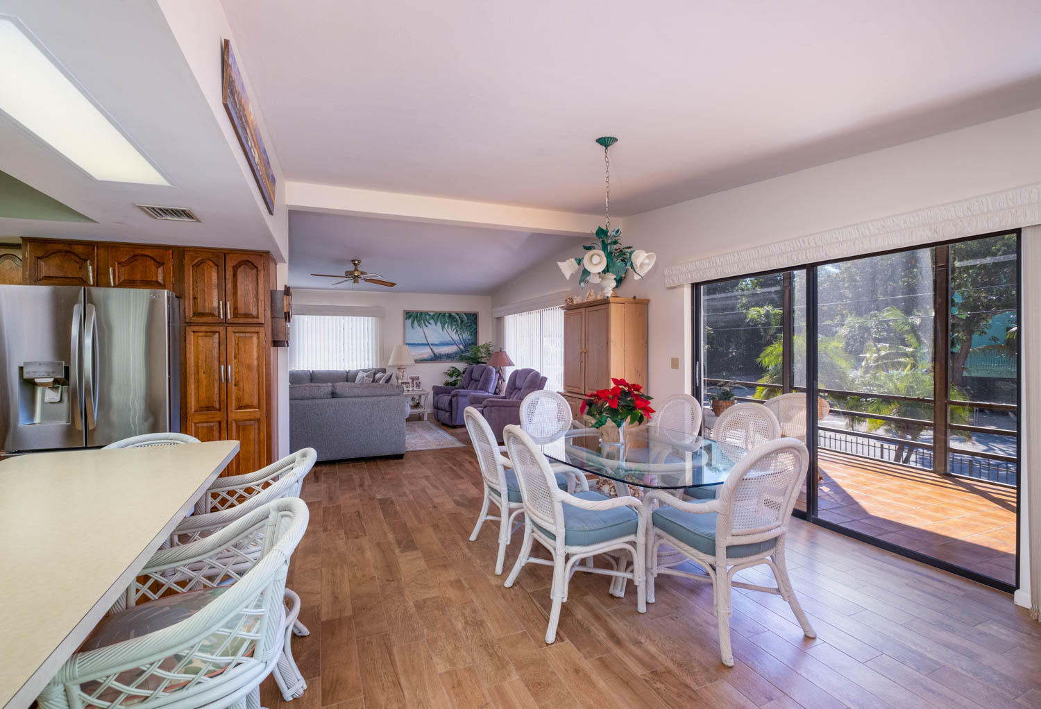 205 Sunset Boulevard Key Largo, FL 33037 - Photo 9 of 42 a view of a dining room with furniture window and wooden floor