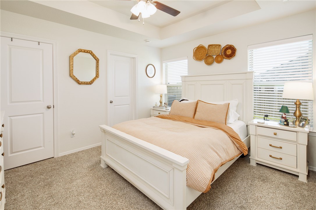 2799 Messenger Way Bryan, TX 77803 - Photo 8 of 15 a spacious bedroom with a bed a dresser and a window