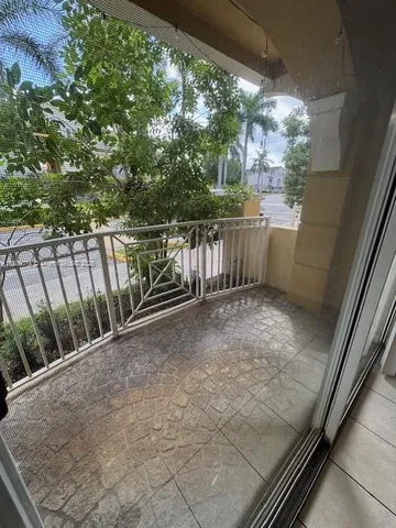 a view of balcony with yard