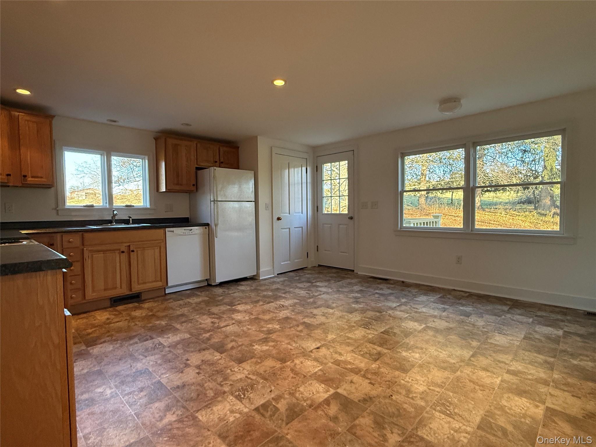156 Sharon Station Road Amenia, NY 12501 - Photo 8 of 17 a view of a kitchen with a sink cabinets and a window