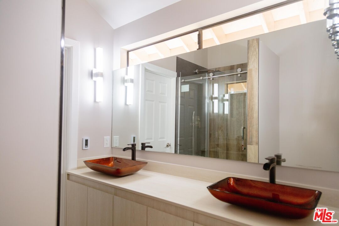 2015 Corral Canyon Road Malibu, CA 90265 - Photo 12 of 24 a bathroom with a sink and a mirror