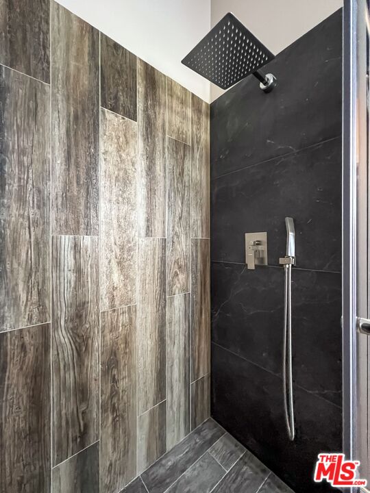 2015 Corral Canyon Road Malibu, CA 90265 - Photo 13 of 24 a bathroom with a shower and a glass door