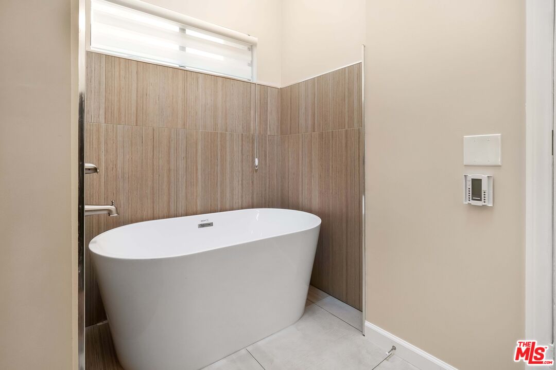 2015 Corral Canyon Road Malibu, CA 90265 - Photo 18 of 24 a white bath tub sitting in a bathroom