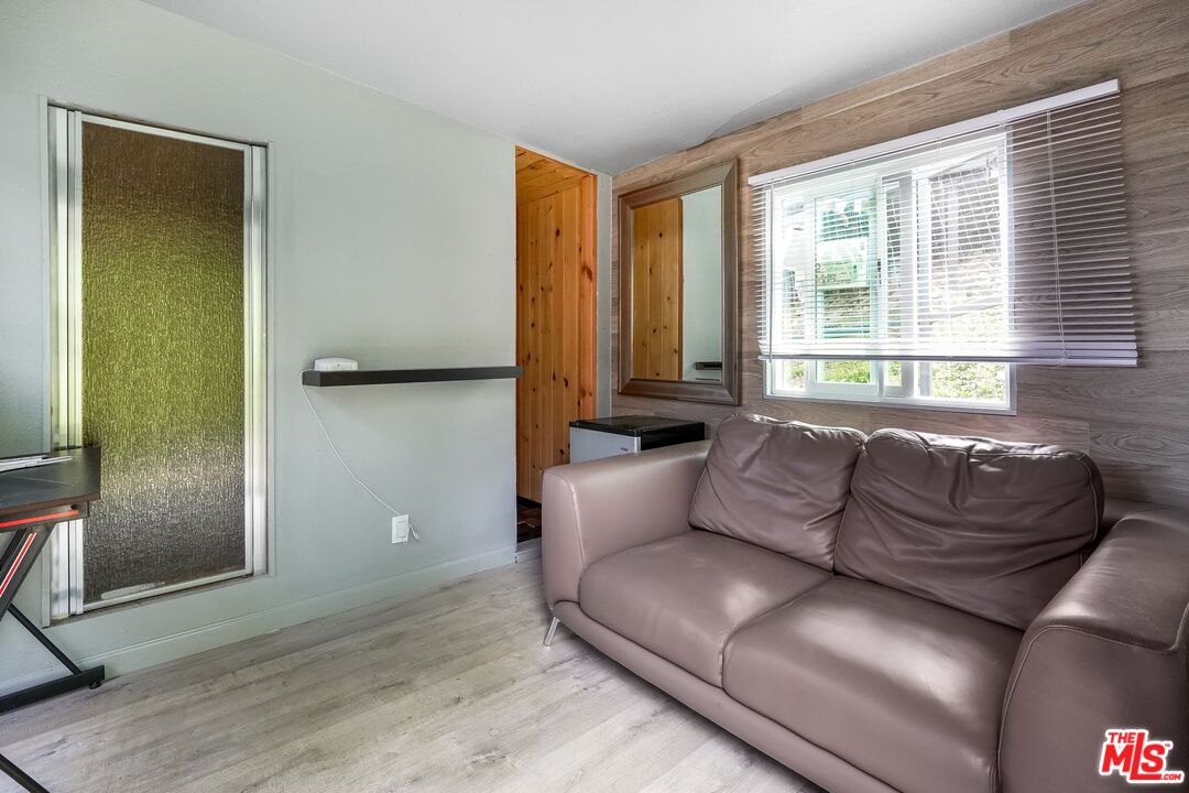 2015 Corral Canyon Road Malibu, CA 90265 - Photo 21 of 24 a living room with furniture and large window
