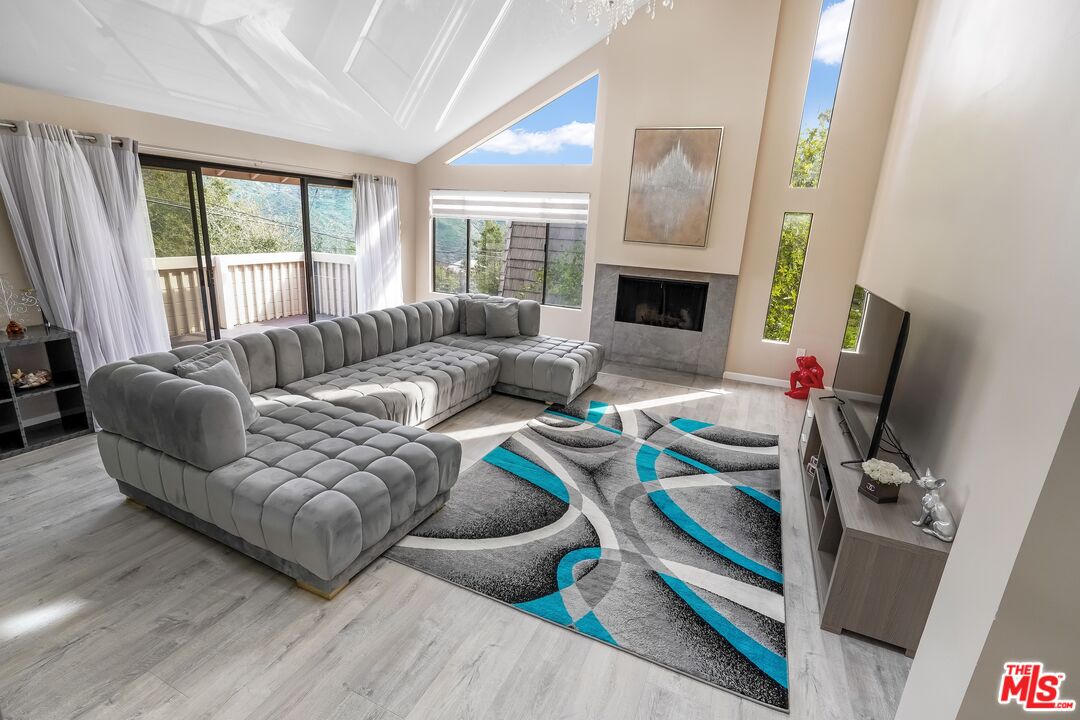 2015 Corral Canyon Road Malibu, CA 90265 - Photo 3 of 24 a living room with furniture and a fireplace