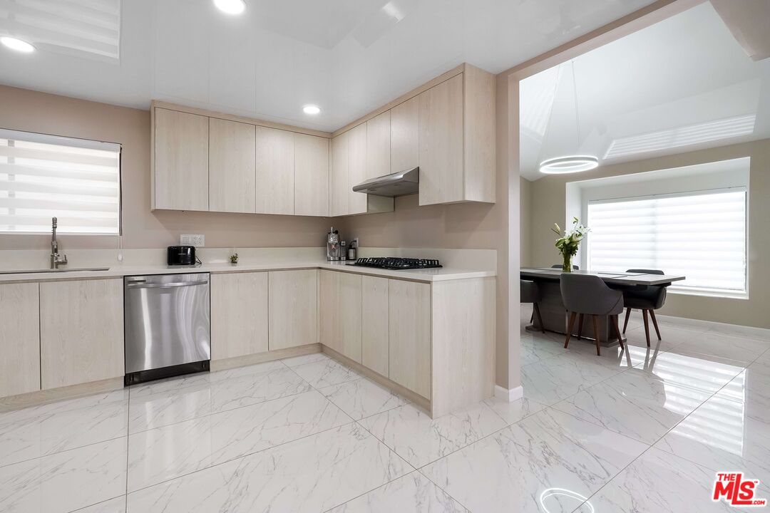 2015 Corral Canyon Road Malibu, CA 90265 - Photo 6 of 24 a kitchen with cabinets and chairs