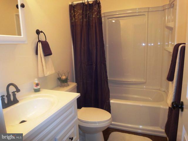 4902 Upper Beckleysville Road Hampstead, MD 21074 - Photo 22 of 25 a bathroom with a sink toilet and shower