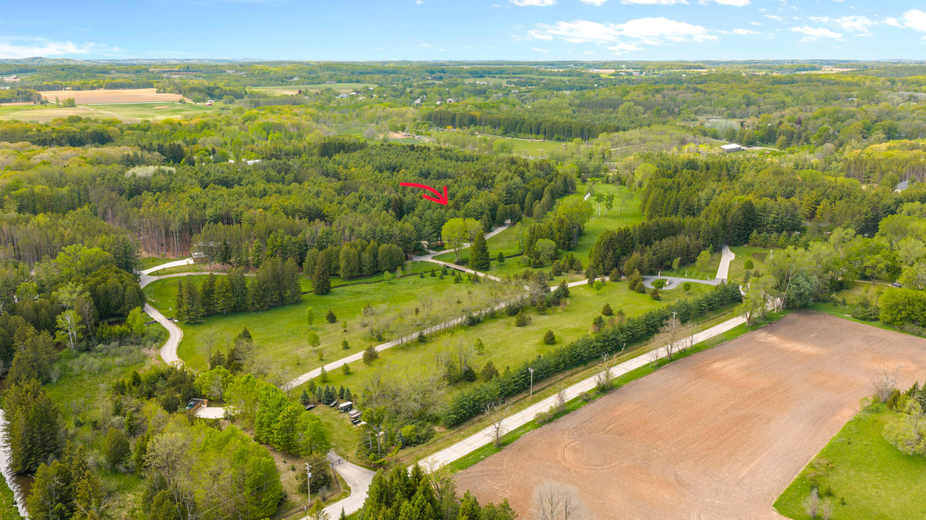 7855 Indian Lore Road, Unit 20 Farmington, WI 53090 - Photo 37 of 38 Drone w_ arrow2