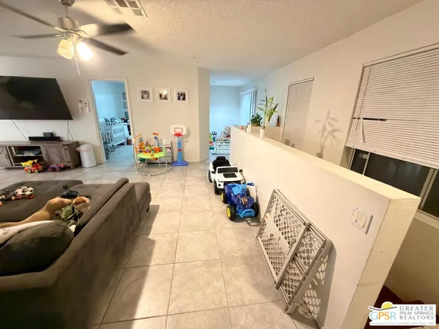 a bed room with a bed and a television