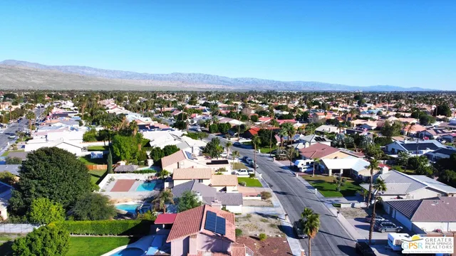 an aerial view of residential houses and trees
