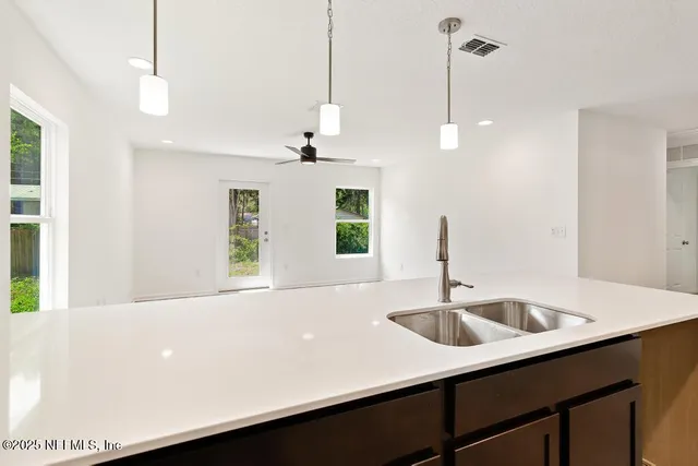 a bathroom with a sink and a window