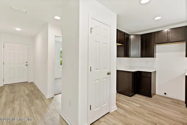a kitchen with a sink and chandelier
