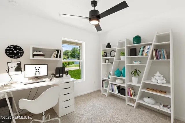 a room with furniture a clock and a window