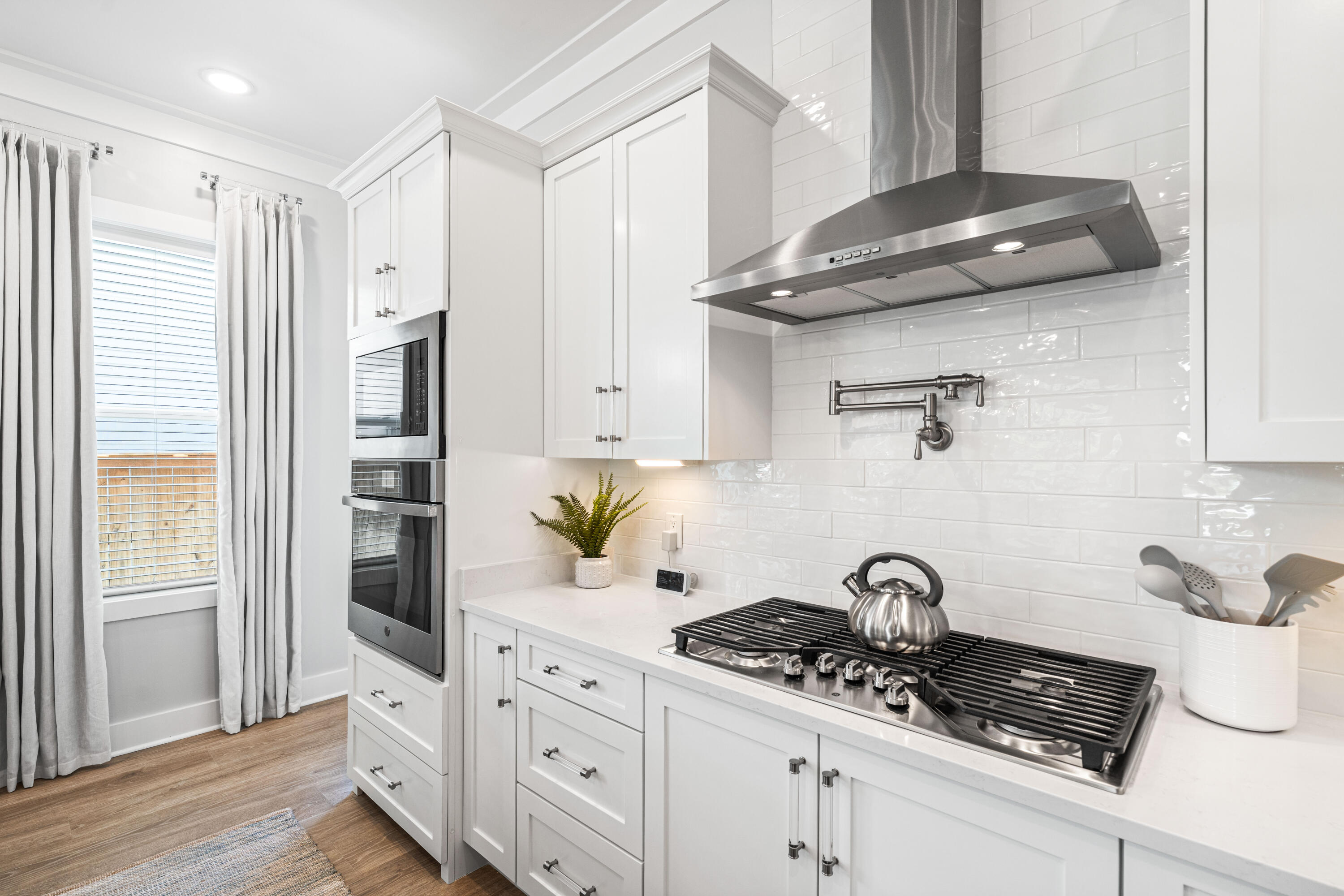 95 West Willow Mist Road Inlet Beach, FL 32461 - Photo 17 of 72 a kitchen with stainless steel appliances a sink a stove and white cabinets