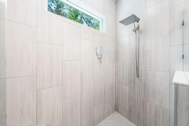 a bedroom with two beds and a window