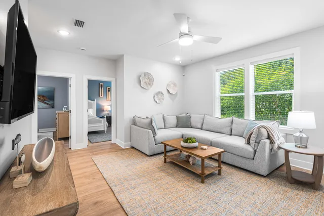 a bedroom with bed and a chandelier