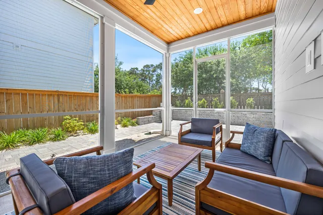 a view of a house with pool and chairs