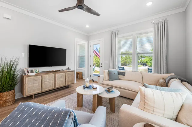 a living room with furniture and a flat screen tv