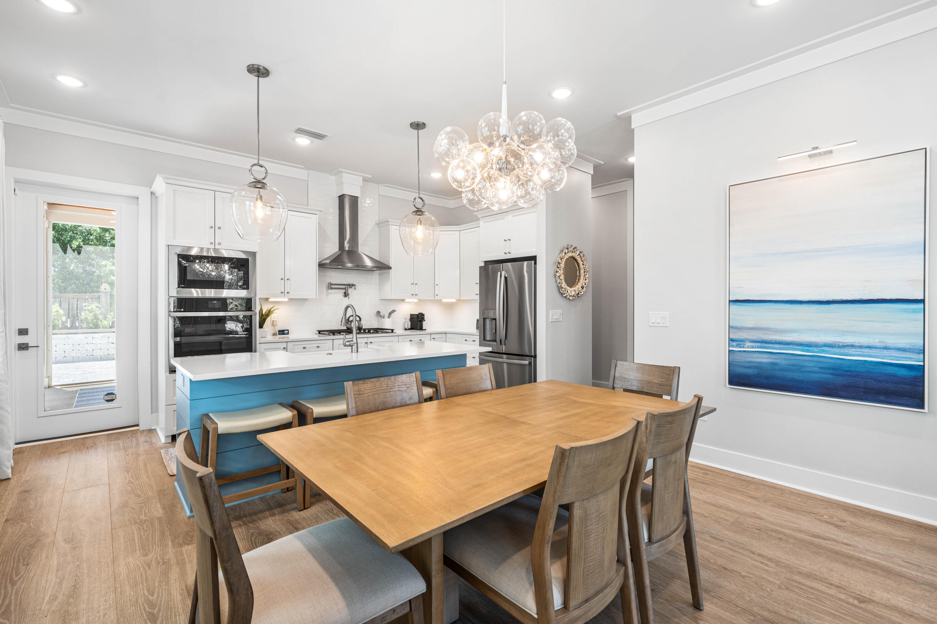 95 West Willow Mist Road Inlet Beach, FL 32461 - Photo 9 of 72 a kitchen with stainless steel appliances kitchen island granite countertop a table chairs and a refrigerator