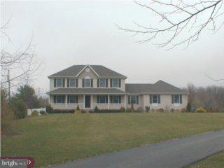 35 Highbridge Road New Egypt, NJ 08533 - Photo 1 of 1 a front view of a house with a garden and yard