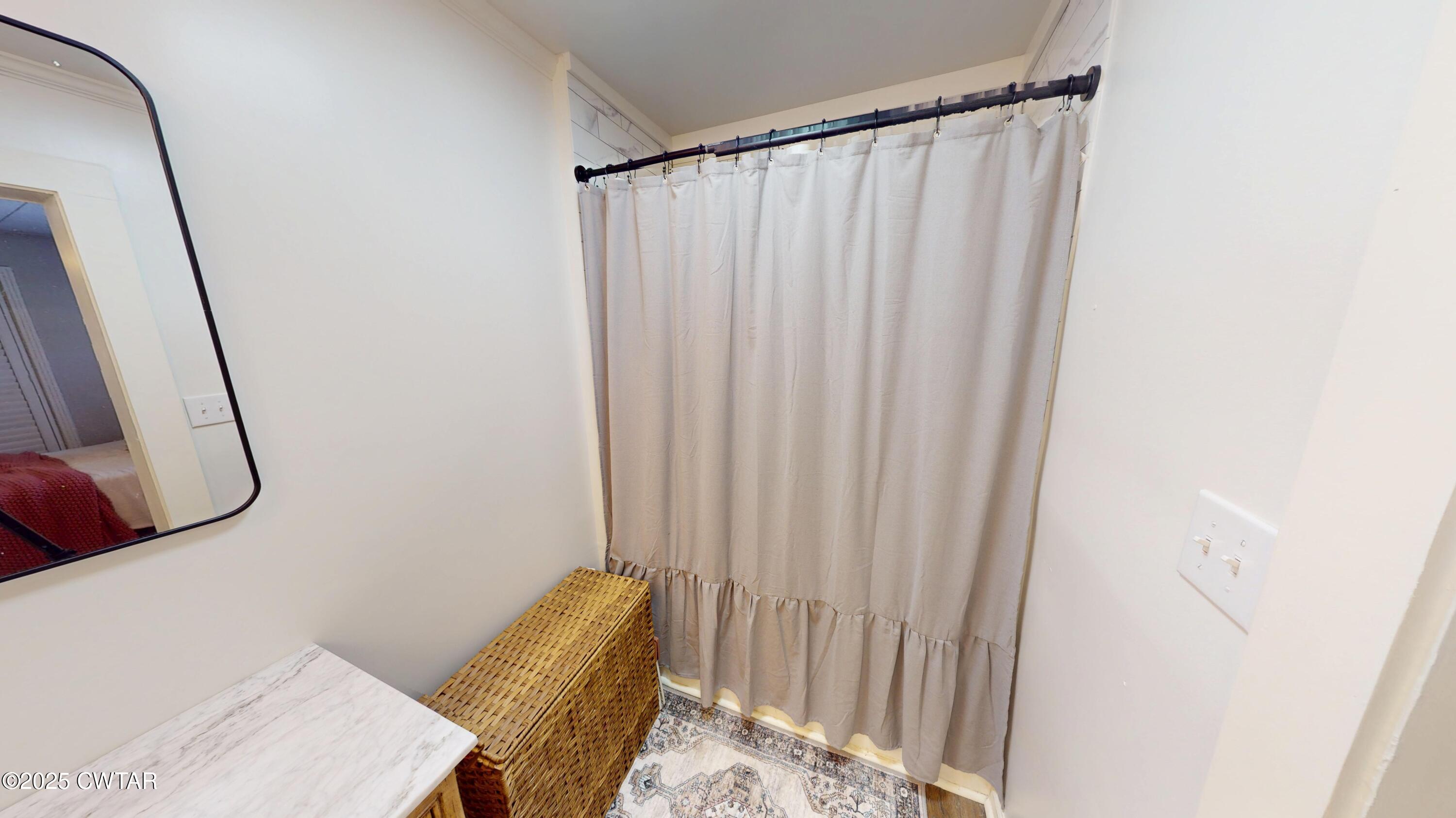 206 Tull Road Kenton, TN 38233 - Photo 18 of 34 a view of a bedroom with a bed and a mirror