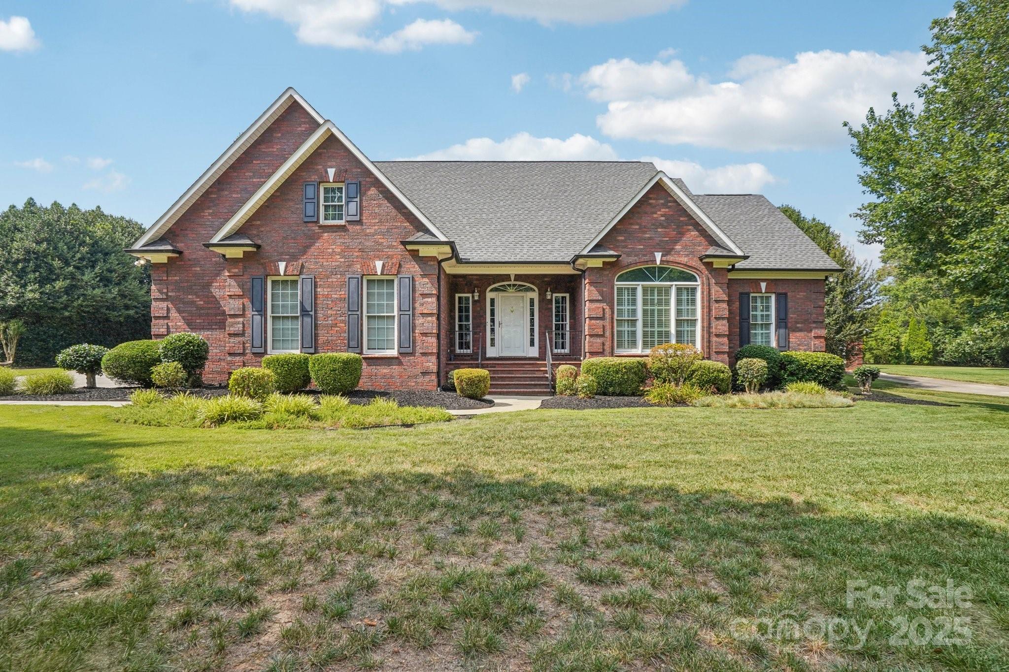 105 Berea Baptist Church Road Stanfield, NC 28163 - Photo 1 of 48 a front view of a house with a yard