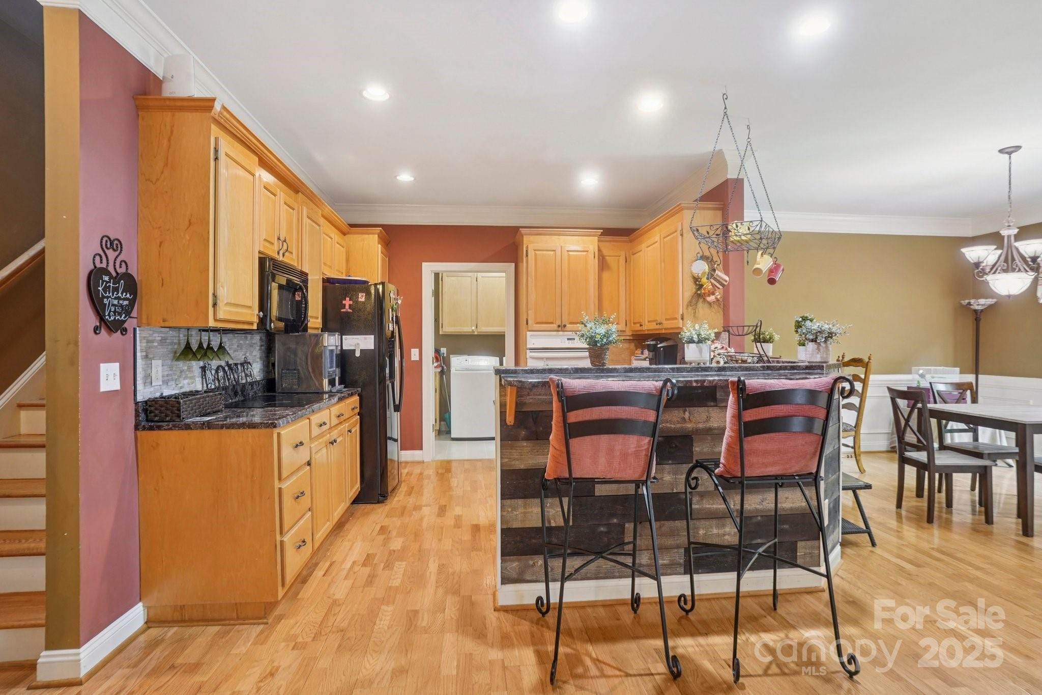 105 Berea Baptist Church Road Stanfield, NC 28163 - Photo 11 of 48 a large kitchen with a table and chairs