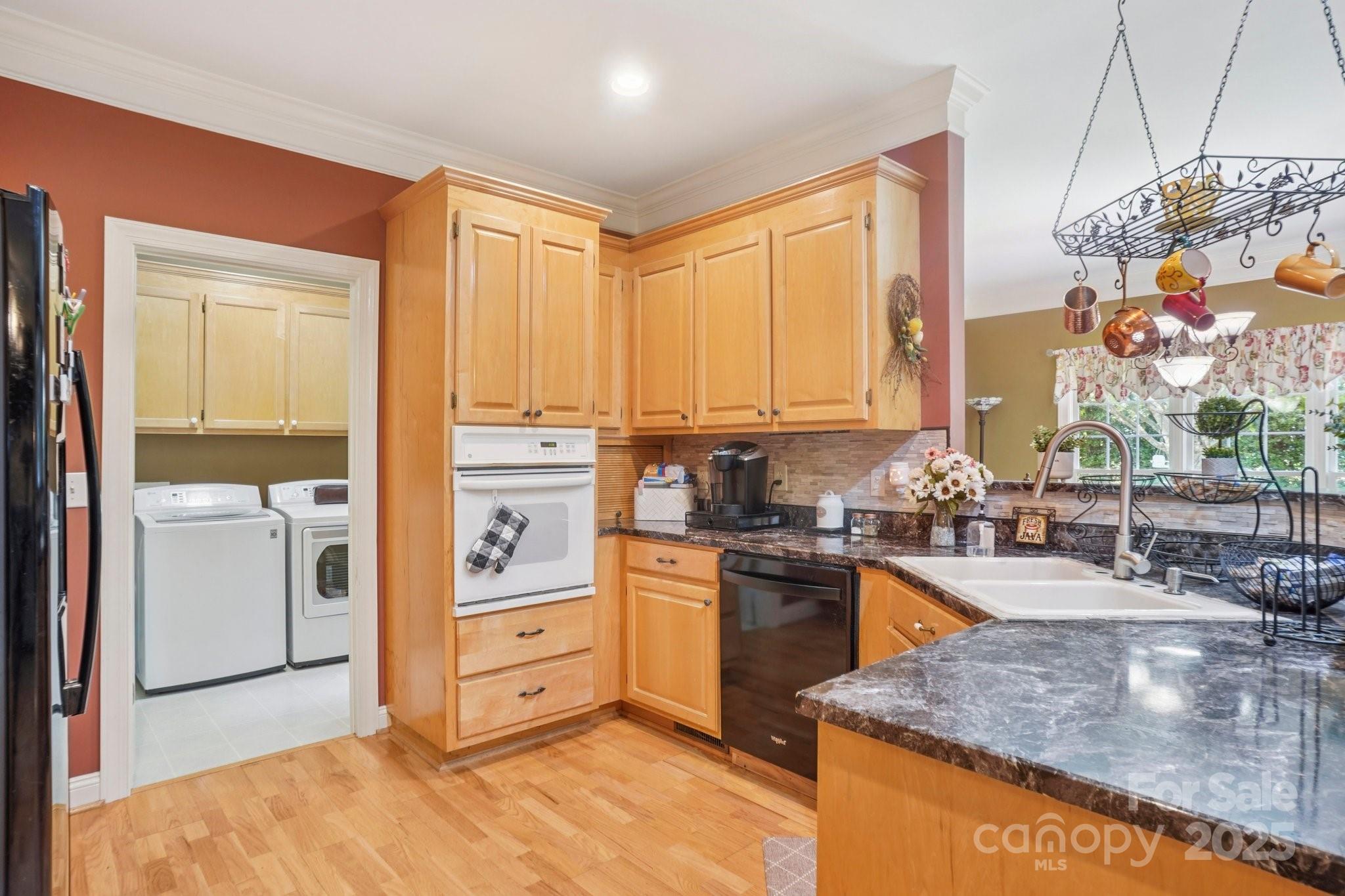 105 Berea Baptist Church Road Stanfield, NC 28163 - Photo 13 of 48 a kitchen with stainless steel appliances granite countertop a stove and a refrigerator