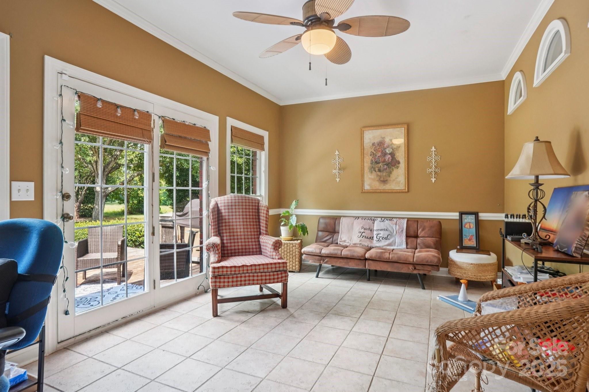 105 Berea Baptist Church Road Stanfield, NC 28163 - Photo 15 of 48 a living room with furniture and a floor to ceiling window