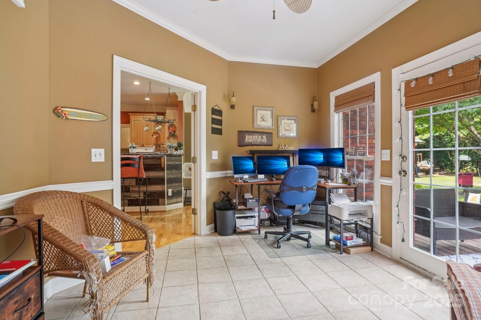 105 Berea Baptist Church Road Stanfield, NC 28163 - Photo 16 of 48 a view of a livingroom with workspace and a window