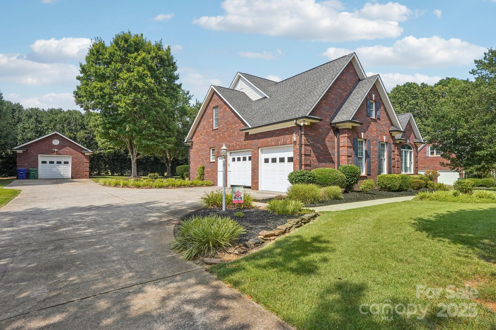 105 Berea Baptist Church Road Stanfield, NC 28163 - Photo 2 of 48 a front view of a house with a yard and garage