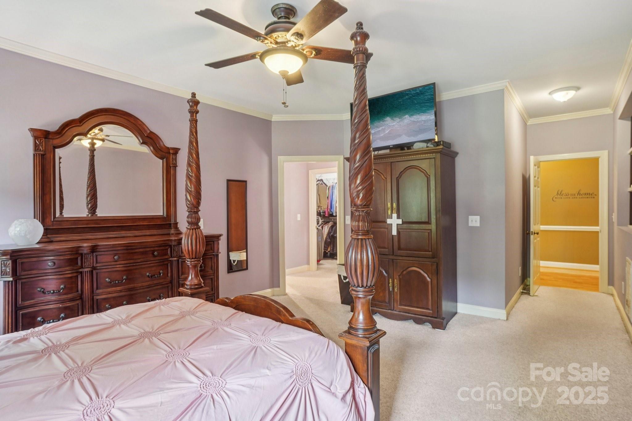 105 Berea Baptist Church Road Stanfield, NC 28163 - Photo 21 of 48 a bedroom with a bed a flat tv screen and dresser