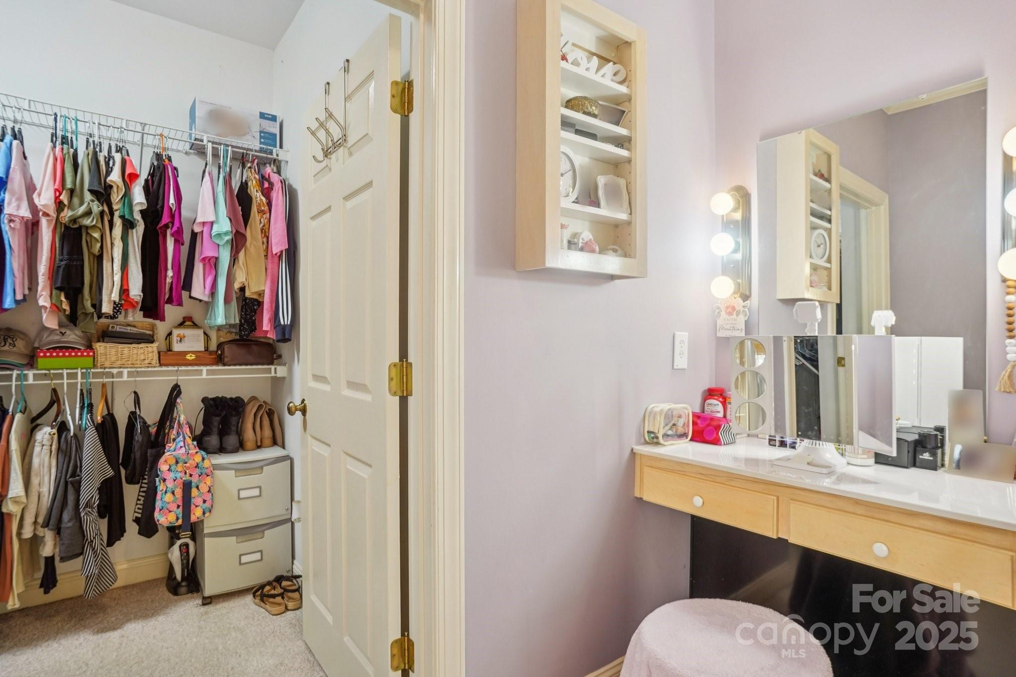 105 Berea Baptist Church Road Stanfield, NC 28163 - Photo 24 of 48 a view of walk in closet with clothes and shoes