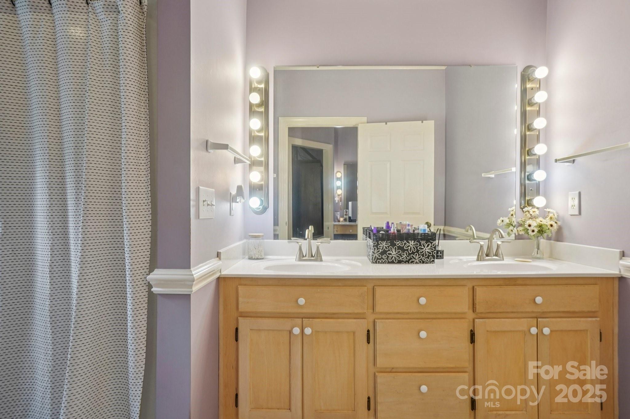 105 Berea Baptist Church Road Stanfield, NC 28163 - Photo 25 of 48 a bathroom with a granite countertop sink and a mirror