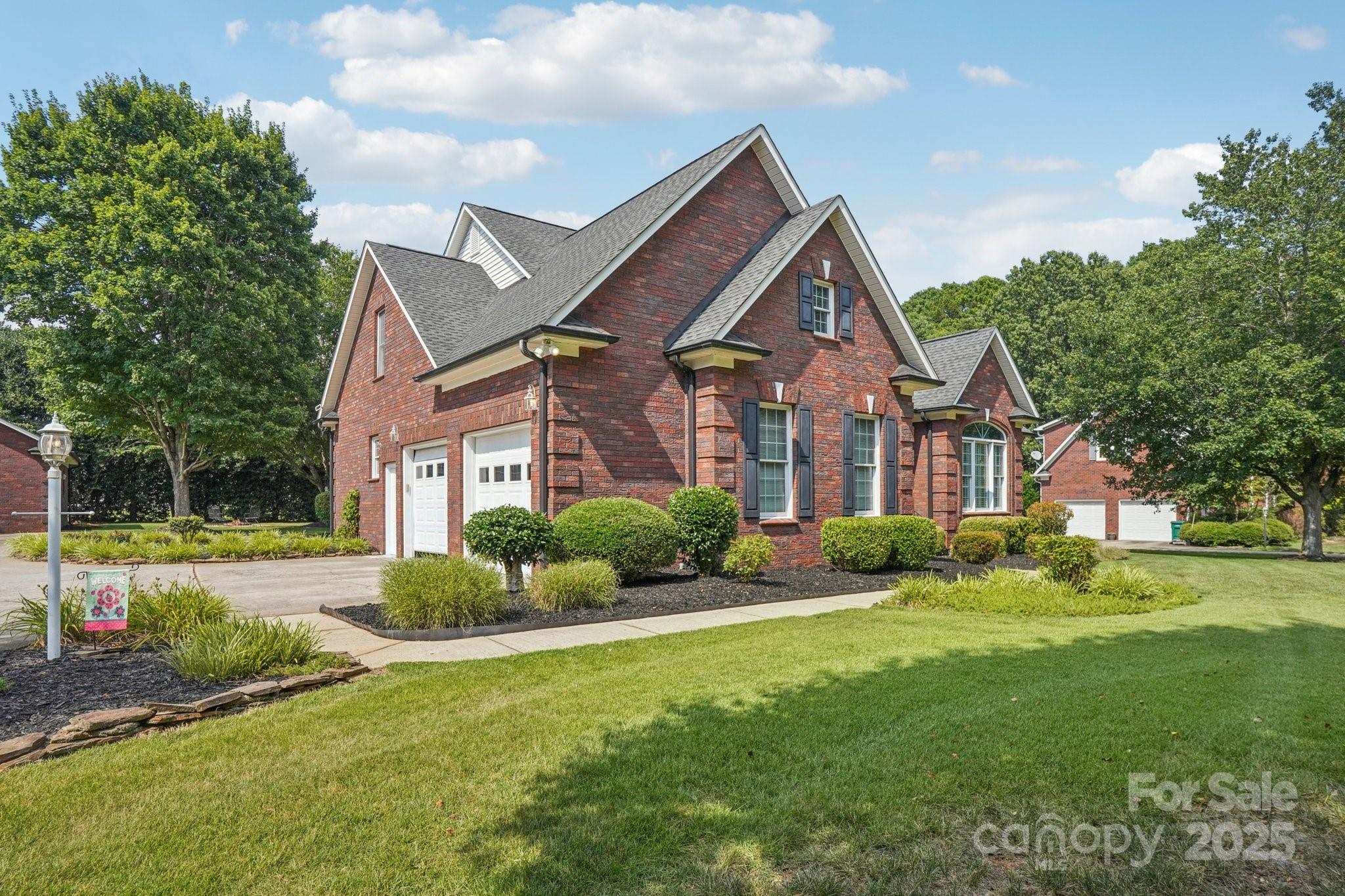 105 Berea Baptist Church Road Stanfield, NC 28163 - Photo 3 of 48 a front view of a house with a yard