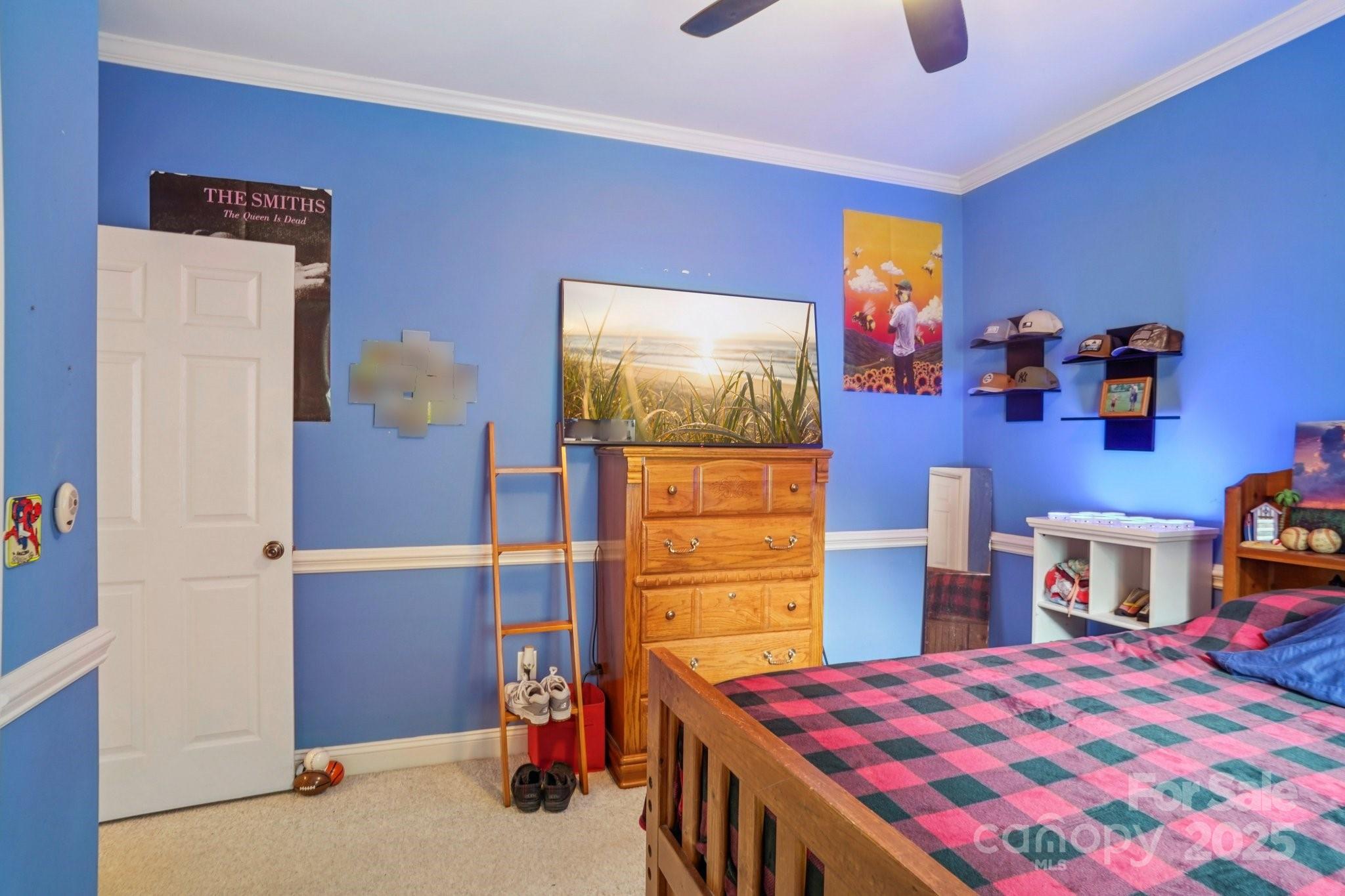 105 Berea Baptist Church Road Stanfield, NC 28163 - Photo 34 of 48 a bedroom with a bed and a closet