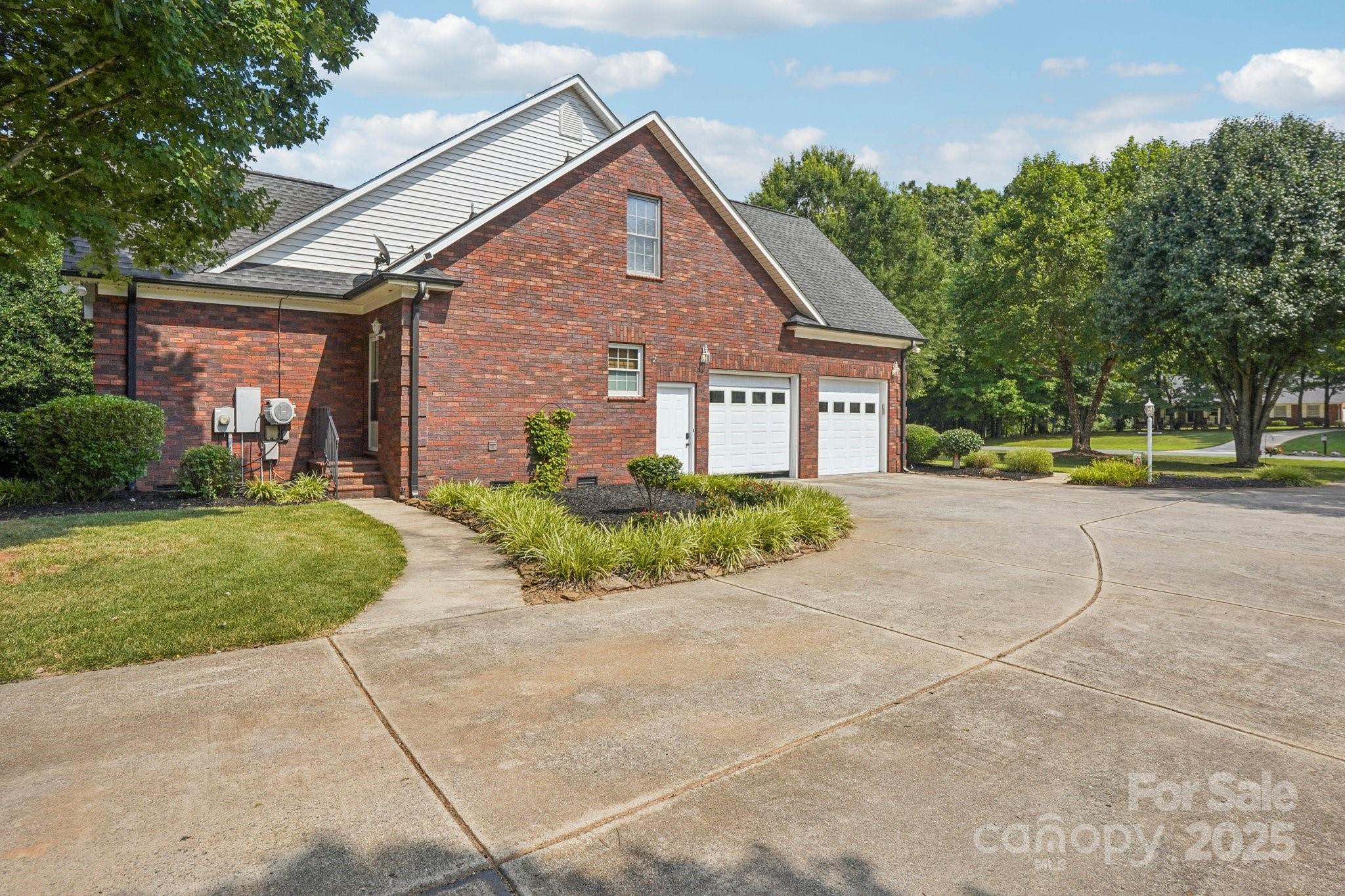 105 Berea Baptist Church Road Stanfield, NC 28163 - Photo 46 of 48 a front view of a house with a yard and potted plants