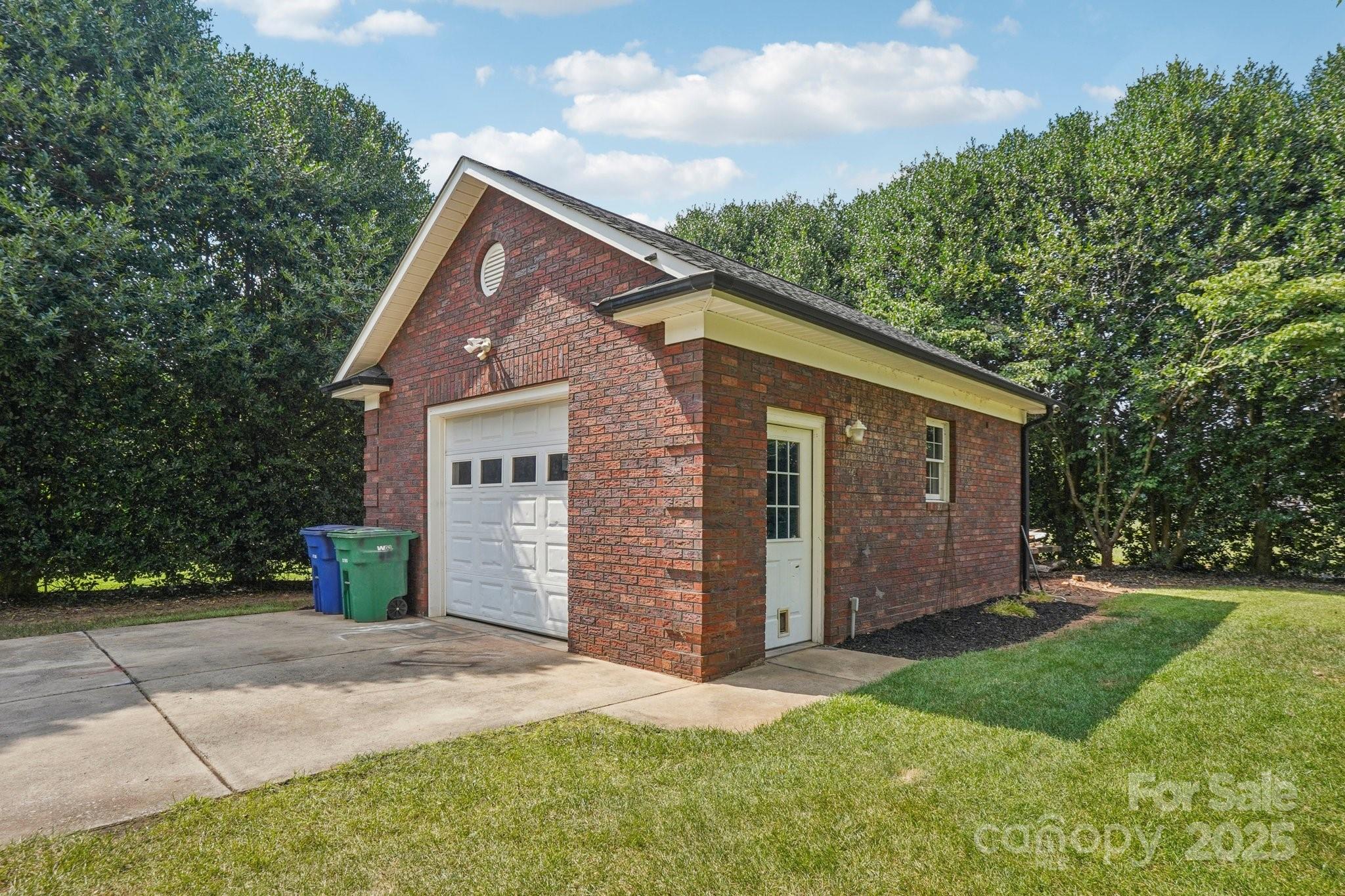 105 Berea Baptist Church Road Stanfield, NC 28163 - Photo 47 of 48 a front view of a house with a yard and garage