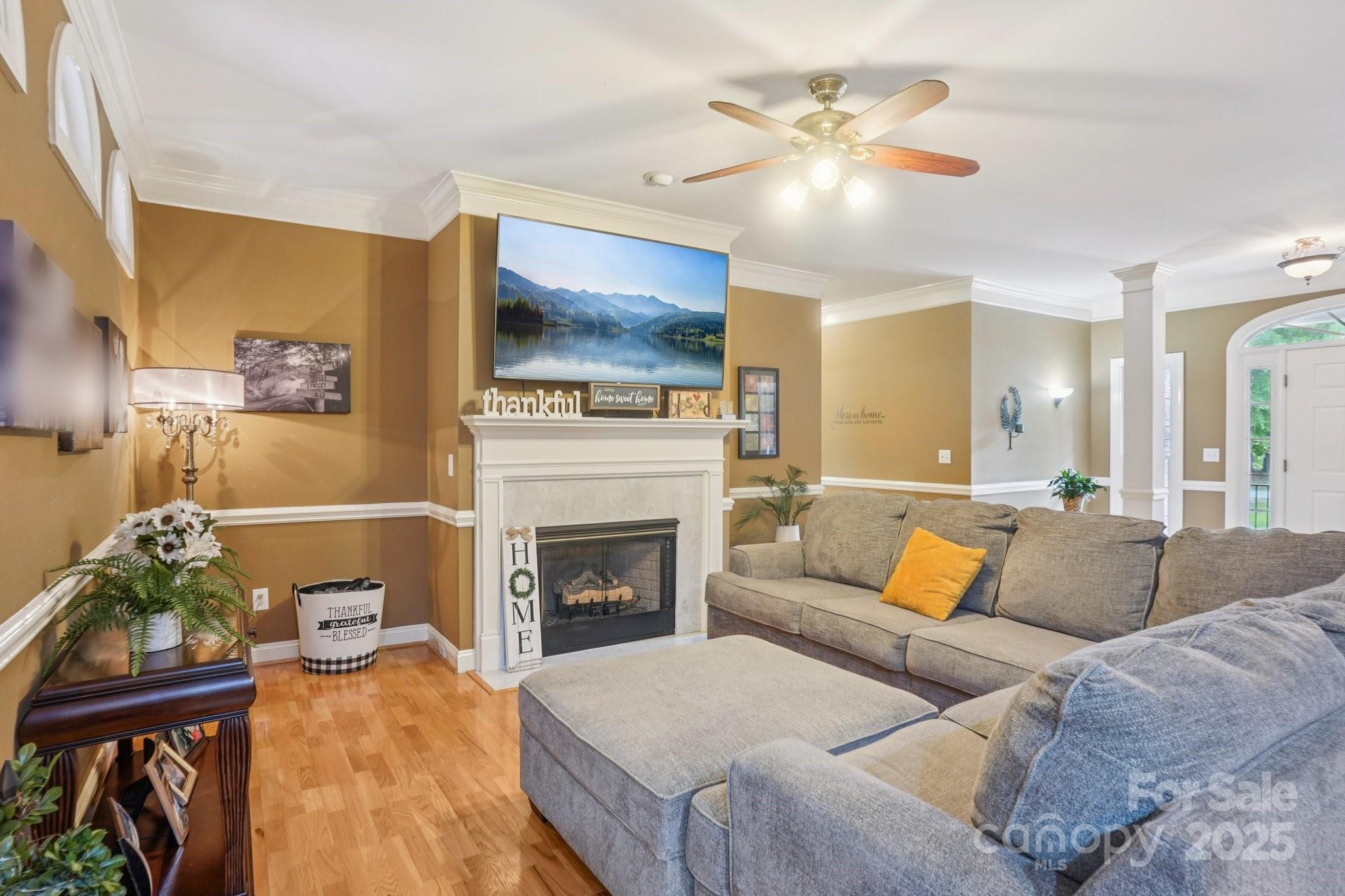 105 Berea Baptist Church Road Stanfield, NC 28163 - Photo 8 of 48 a living room with furniture and a fireplace